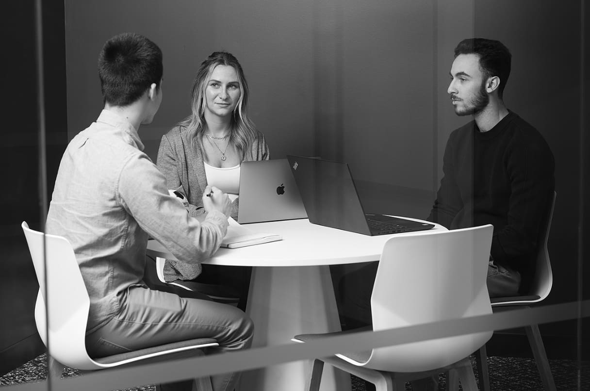 Wiss team evaluating AI accounting tools during a structured vetting session with laptops and notes